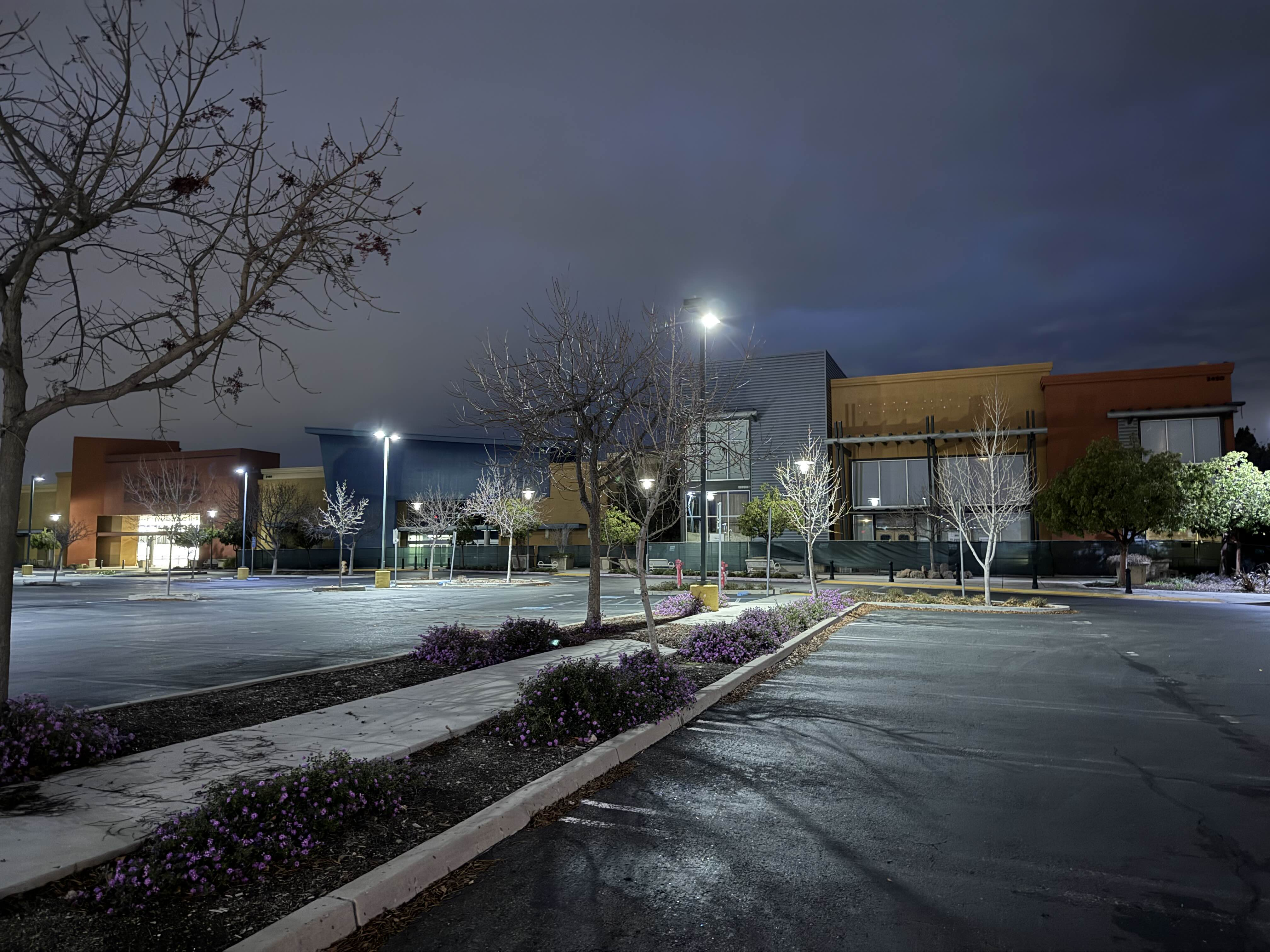A deserted strip mall at night